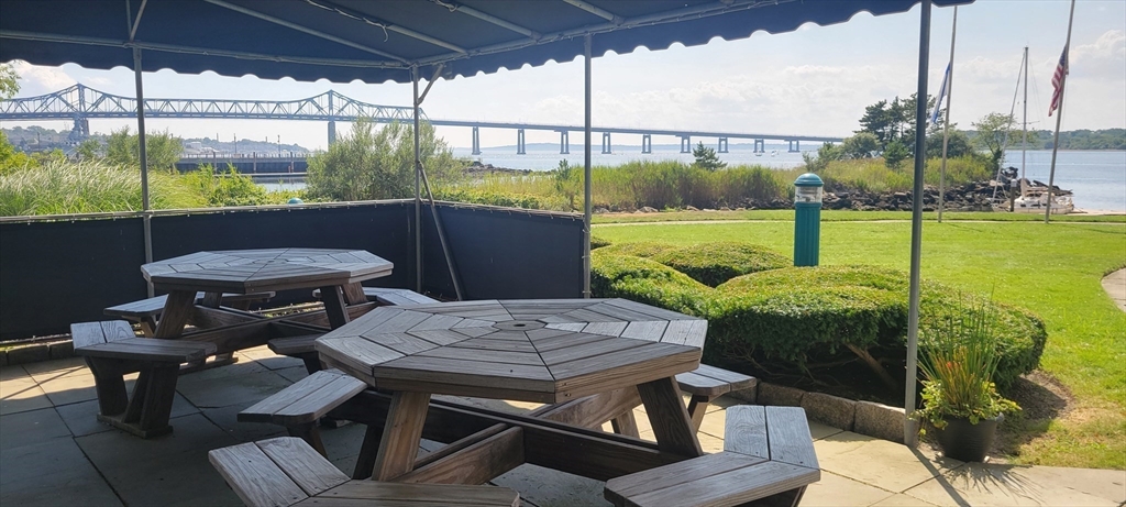 750 Davol Street, Unit 1012 Fall River, MA 02720 - Photo 29 of 29 a view of a balcony with chair and table