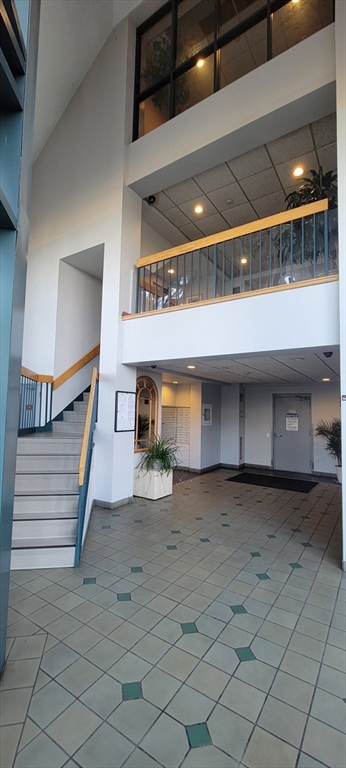 750 Davol Street, Unit 1012 Fall River, MA 02720 - Photo 4 of 29 a view of a hallway with stairs
