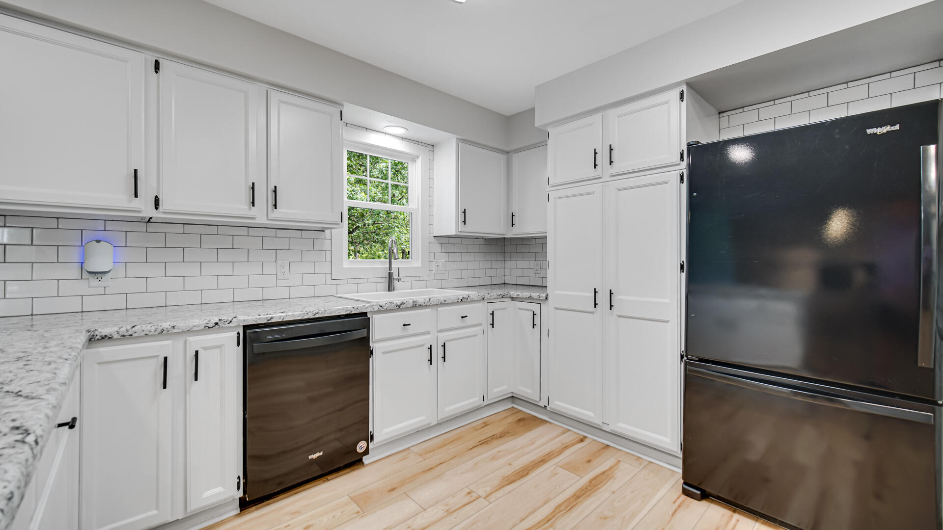 6717 State Rte 49 Rensselaer, IN 47978 - Photo 9 of 31 a kitchen with a refrigerator sink and cabinets