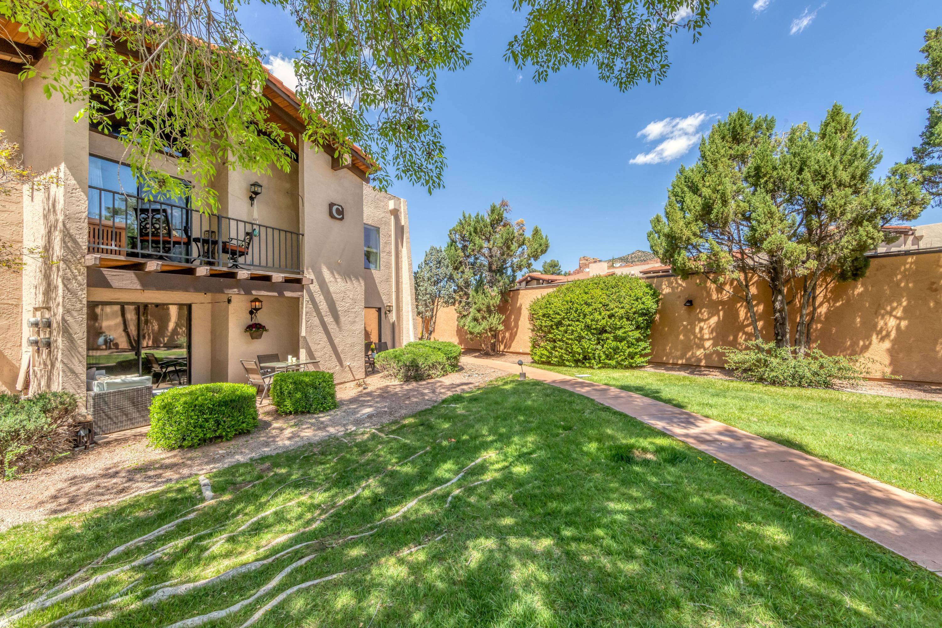 65 Verde Valley School Road, Unit C8 Sedona, AZ 86351 - Photo 1 of 26 a view of a front of a house with a yard