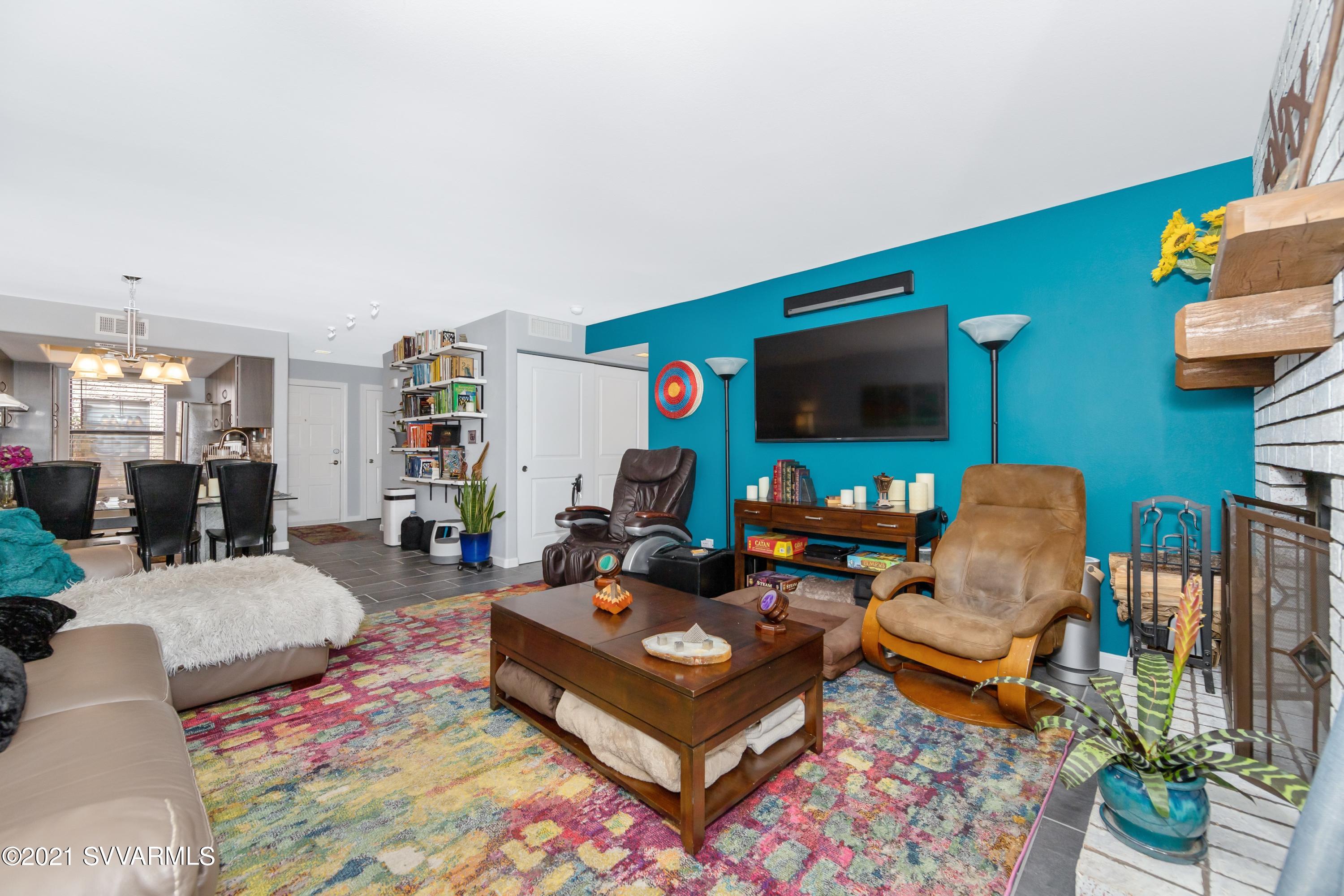 65 Verde Valley School Road, Unit C8 Sedona, AZ 86351 - Photo 5 of 26 a living room with furniture and a flat screen tv