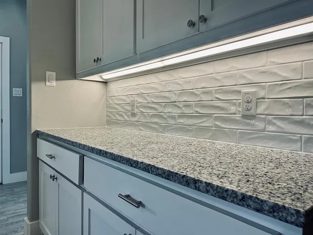 a refrigerator freezer sitting inside of a kitchen