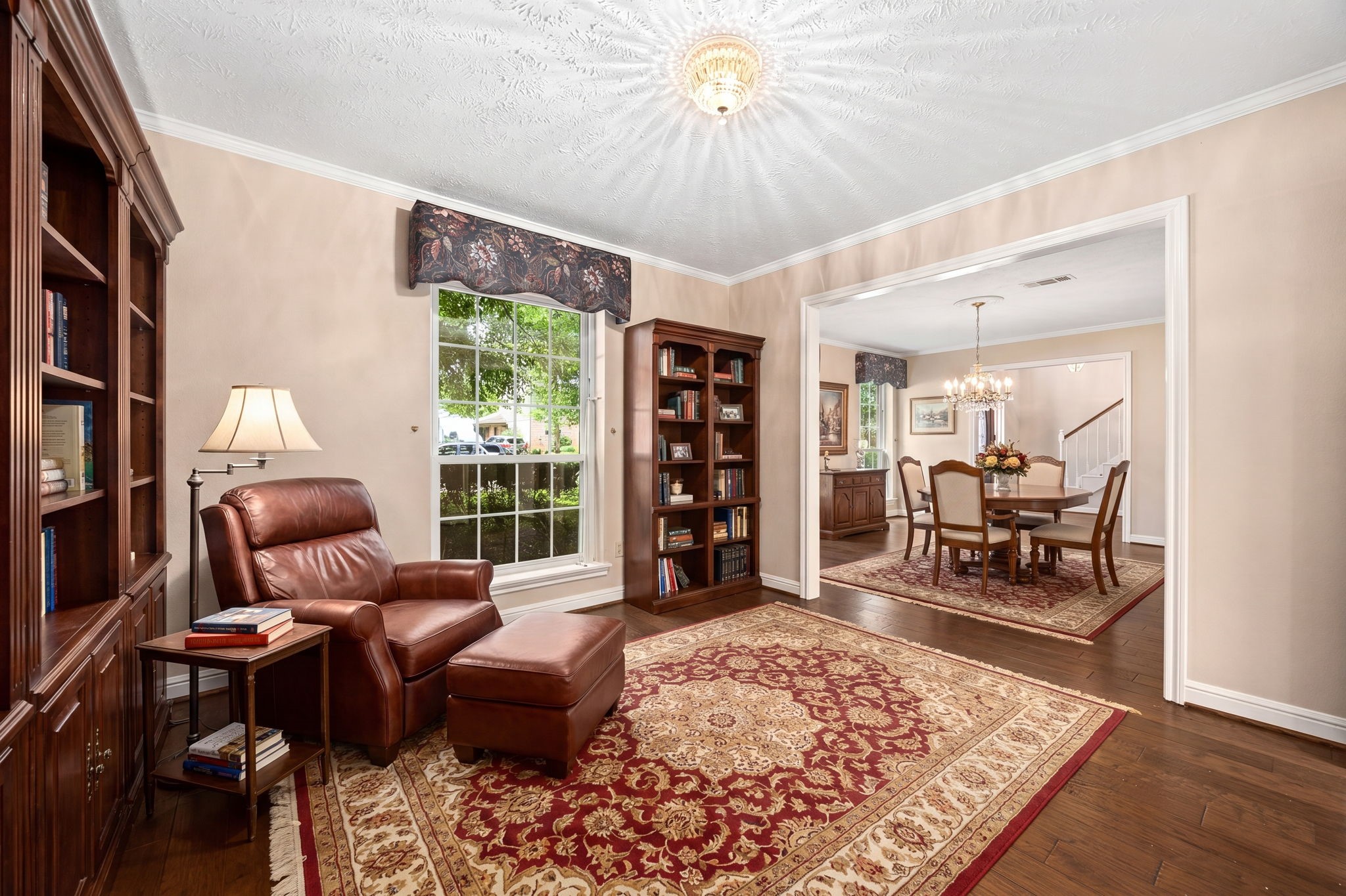 6623 Ampton Drive Spring, TX 77379 - Photo 10 of 45 The smaller room next to the kitchen could be arranged as a music room, library, or a wine tasting area. This room would be perfect as the formal dining room with a round table. Virtually staged.