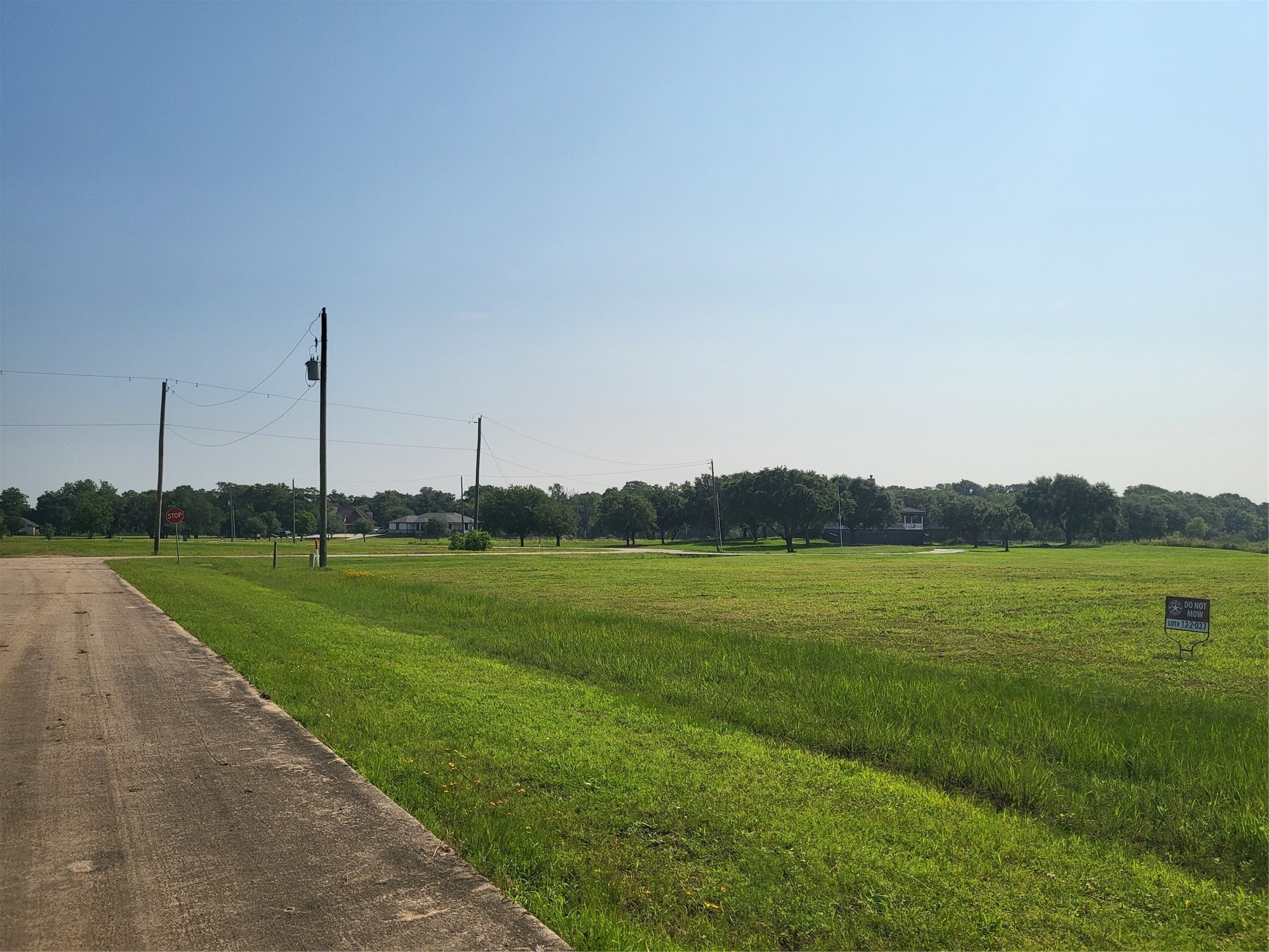 Lot 71 Conestoga Trail Angleton, TX 77515 - Photo 4 of 5 a view of a green field with an ocean view
