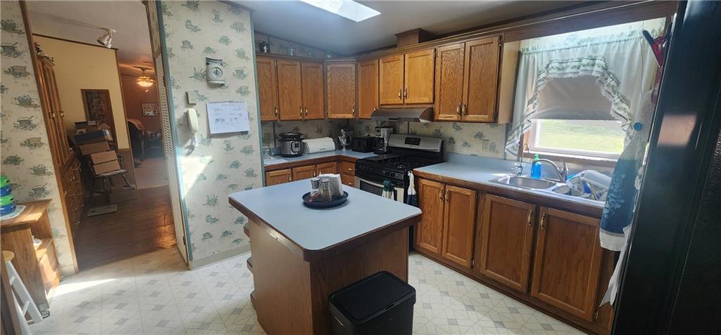 1374 Saltsburg Road Clarksburg, PA 15725 - Photo 11 of 22 a kitchen with stainless steel appliances granite countertop a sink stove and refrigerator