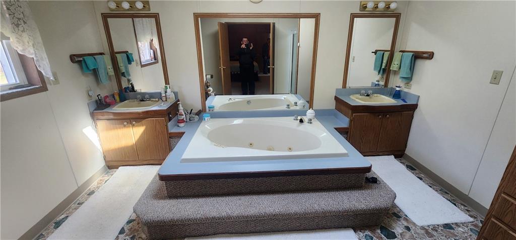 1374 Saltsburg Road Clarksburg, PA 15725 - Photo 17 of 22 a bathroom with sink bathtub and mirror
