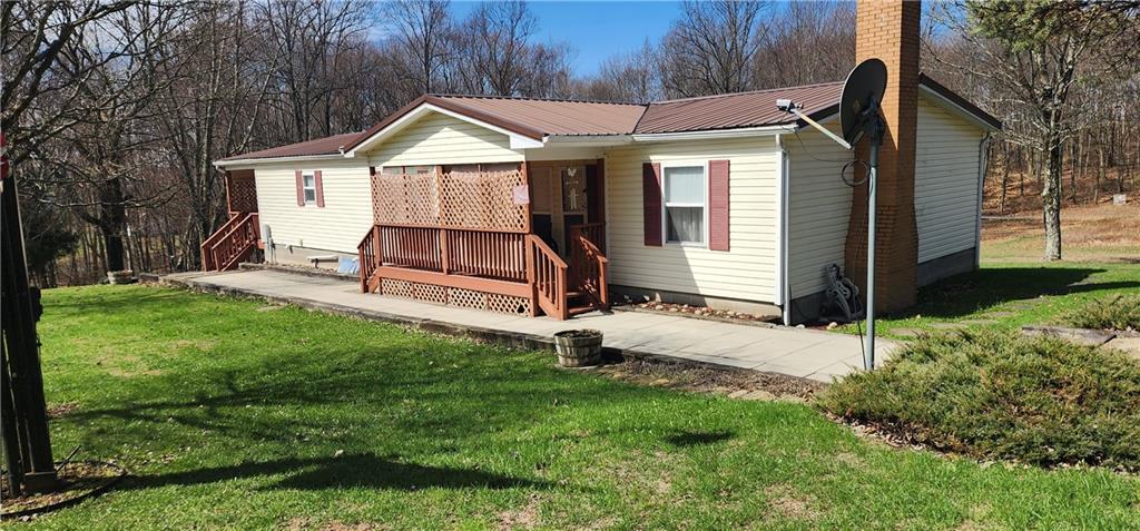 1374 Saltsburg Road Clarksburg, PA 15725 - Photo 2 of 22 a view of a chair and table in backyard of the house