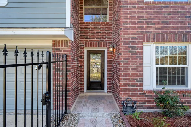 a view of a brick house with an windows