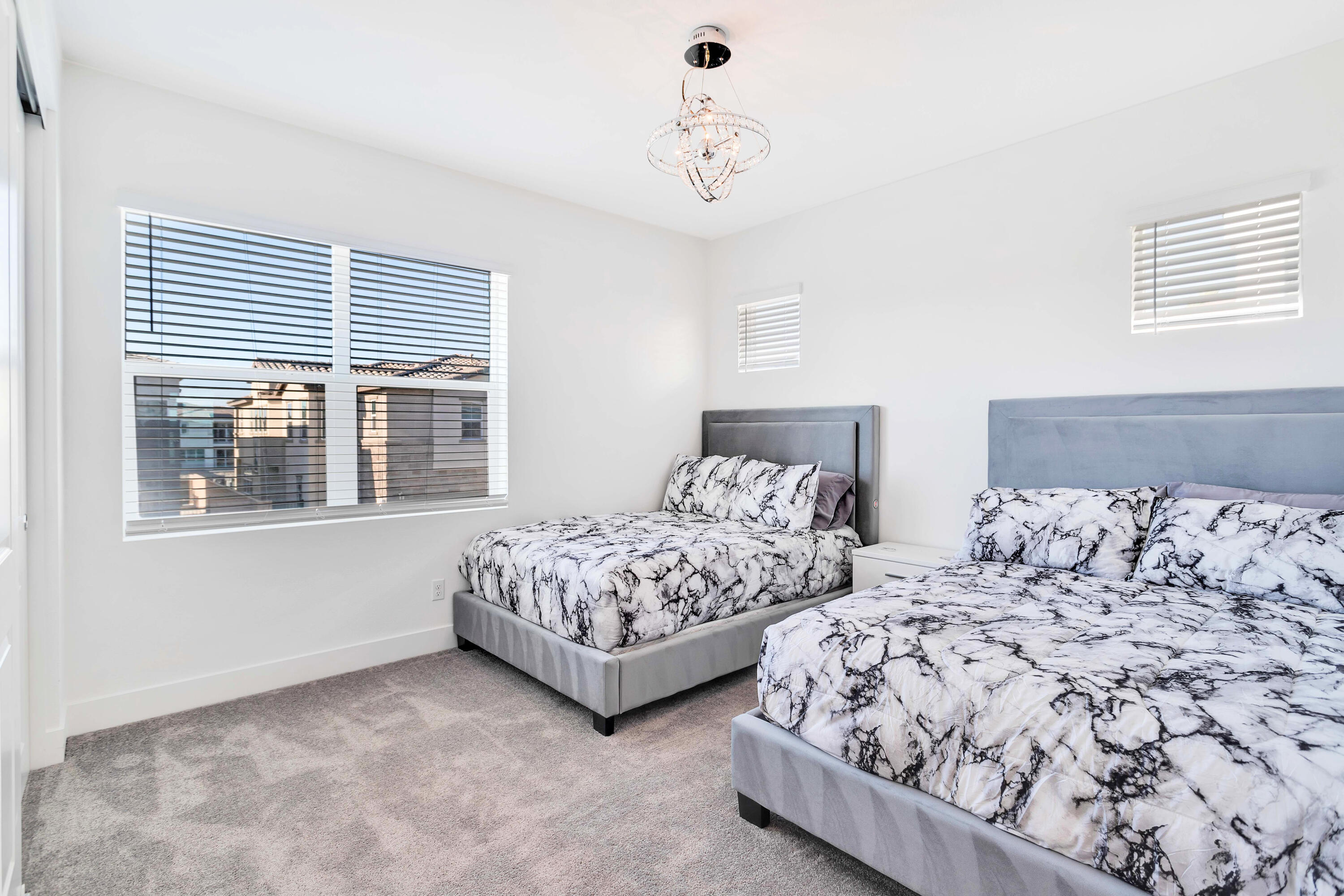 43180 Portuale Court Indio, CA 92203 - Photo 37 of 99 a bedroom with two beds and a window