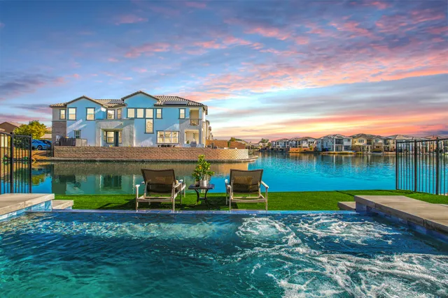 a bedroom with two beds and a window