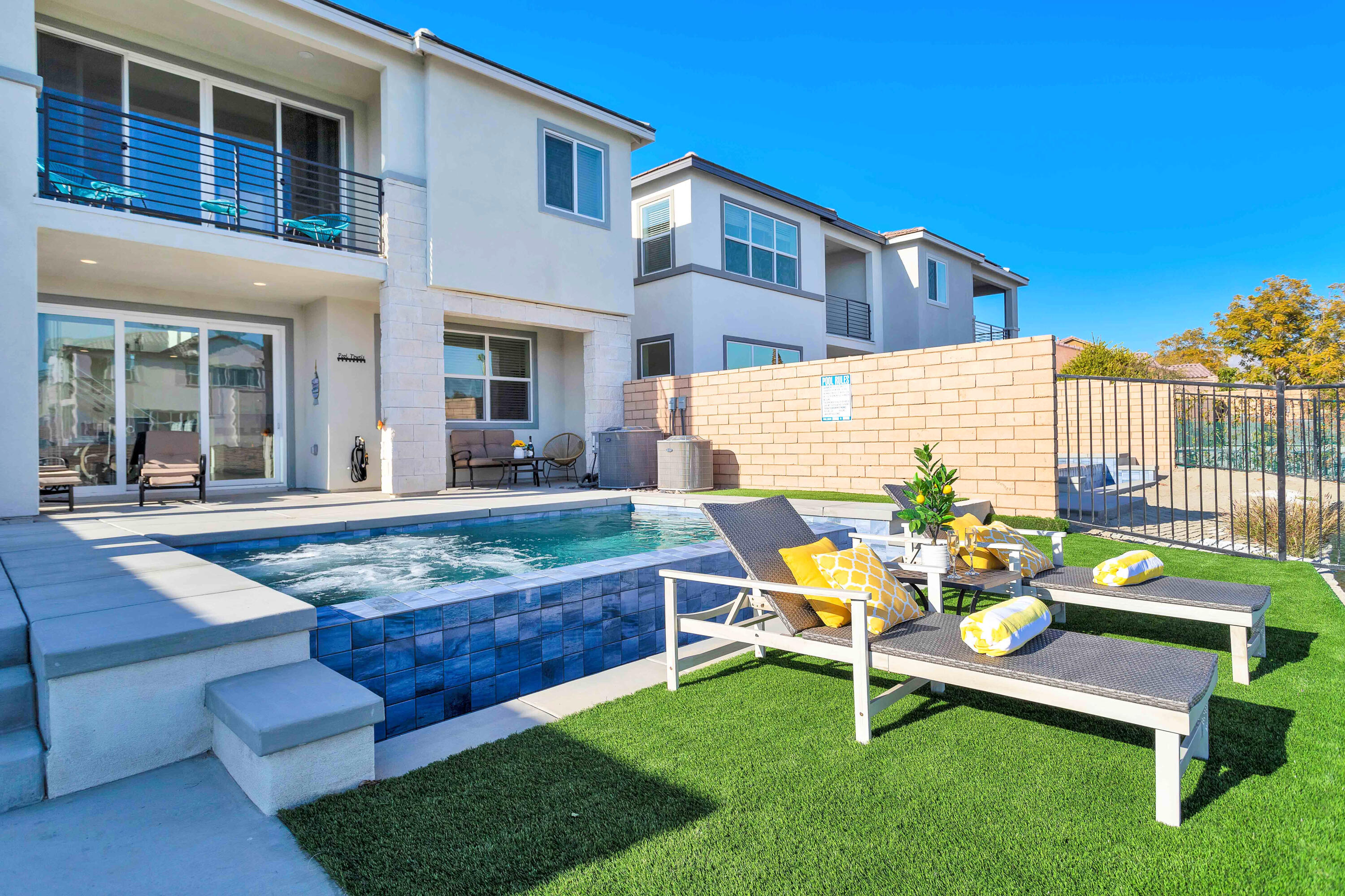 43180 Portuale Court Indio, CA 92203 - Photo 71 of 99 a backyard of a house with table and chairs