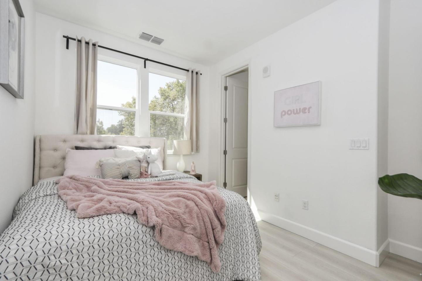 2043 Atlas Loop Mountain View, CA 94043 - Photo 11 of 42 a bedroom with a bed and a window