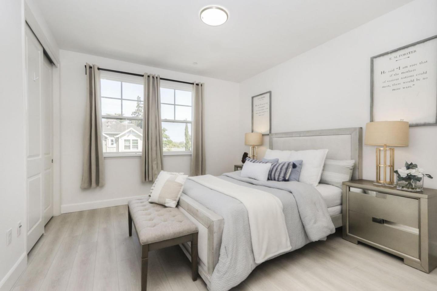 2043 Atlas Loop Mountain View, CA 94043 - Photo 16 of 42 a bedroom with a bed and a lamp on table