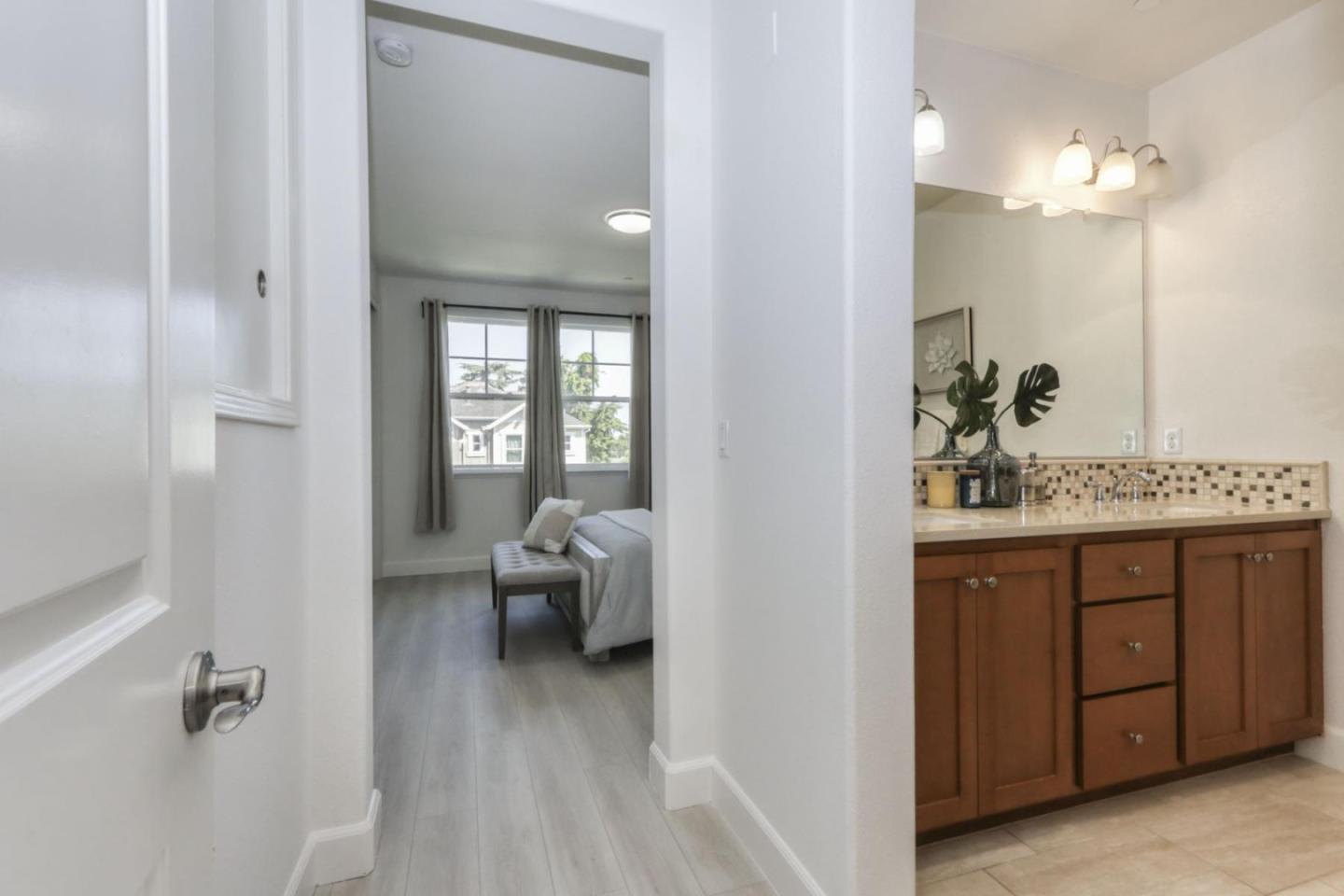 2043 Atlas Loop Mountain View, CA 94043 - Photo 18 of 42 a en suite bathroom with a sink and a mirror