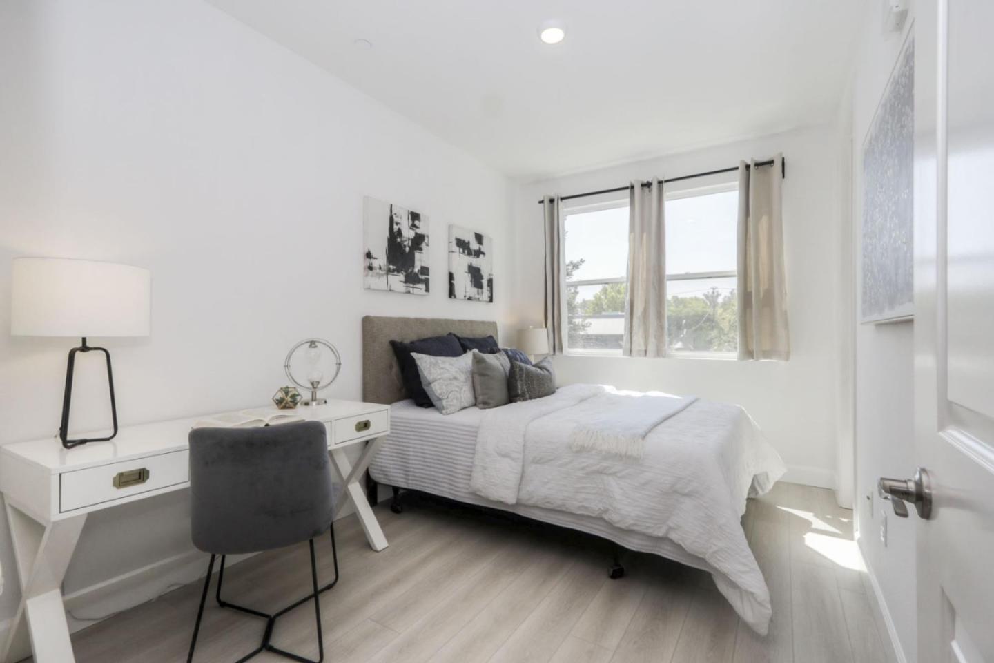 2043 Atlas Loop Mountain View, CA 94043 - Photo 20 of 42 a bedroom with a bed a table and chair