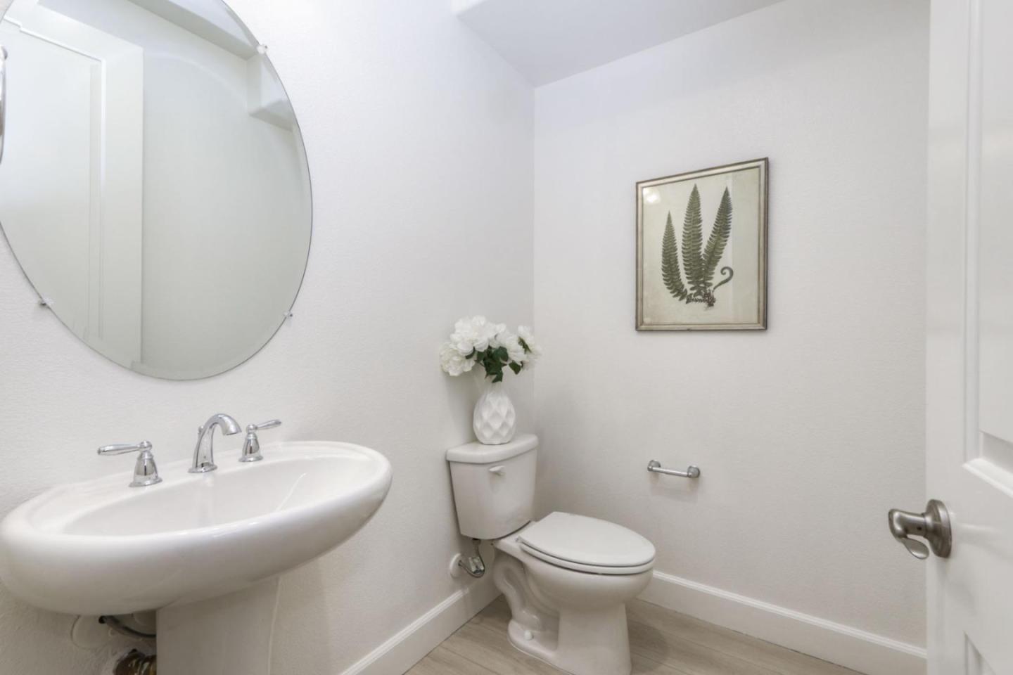 2043 Atlas Loop Mountain View, CA 94043 - Photo 24 of 42 a bathroom with a toilet a sink and mirror
