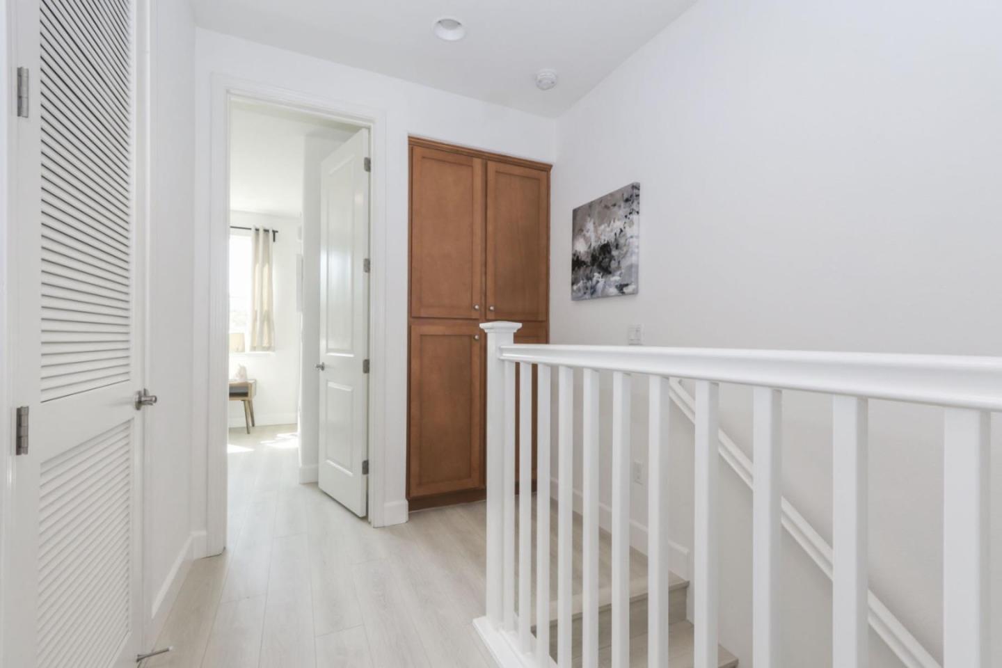 2043 Atlas Loop Mountain View, CA 94043 - Photo 30 of 42 a view of a hallway with wooden floor and closet area