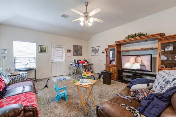 a living room with furniture and a couch