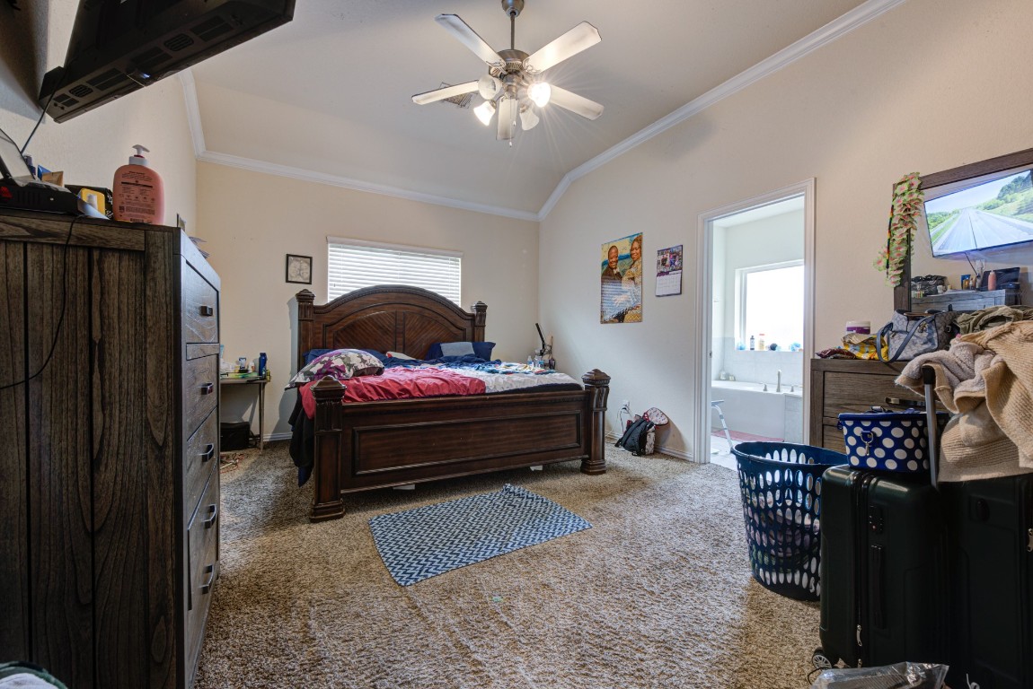 1510 Bella Garden Spring, TX 77373 - Photo 13 of 21 a bedroom with furniture and a chandelier