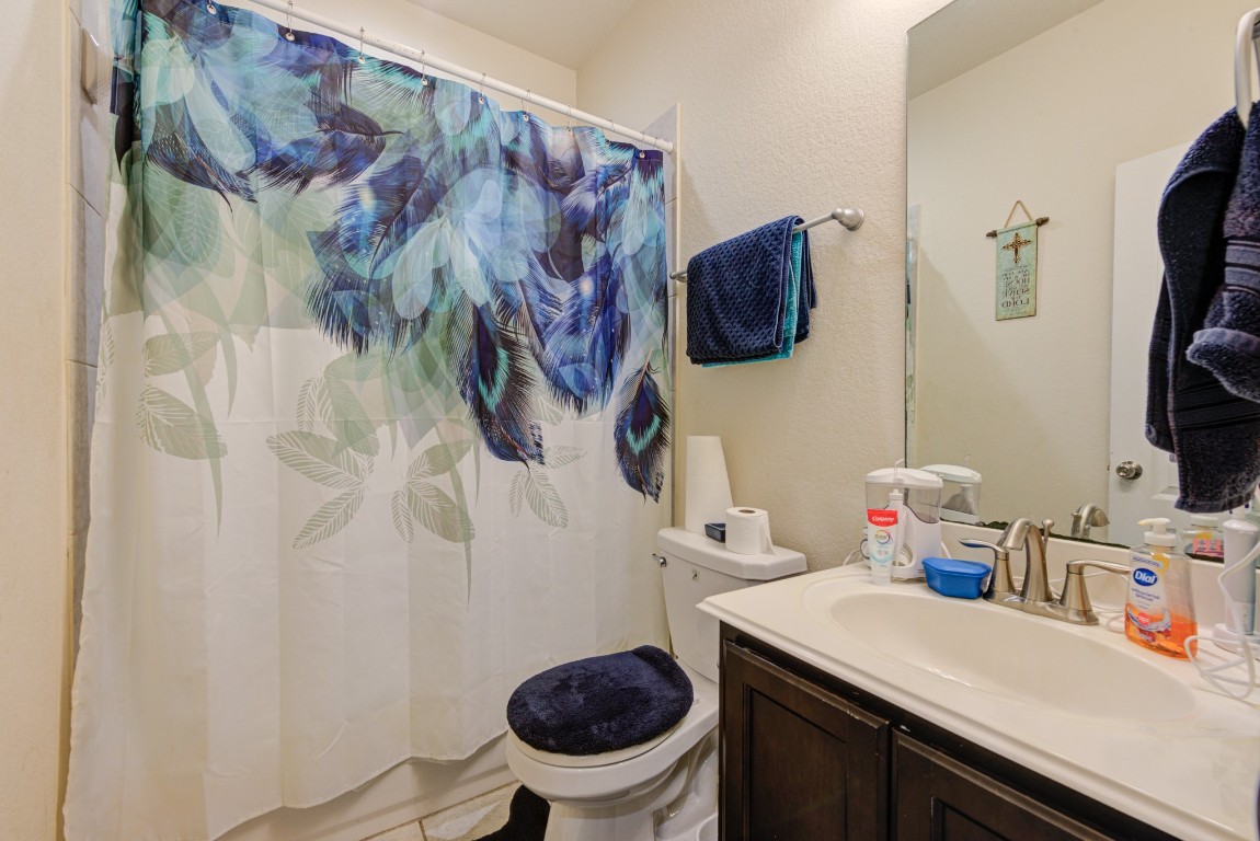 1510 Bella Garden Spring, TX 77373 - Photo 17 of 21 a bathroom with a sink a toilet and a shower curtain