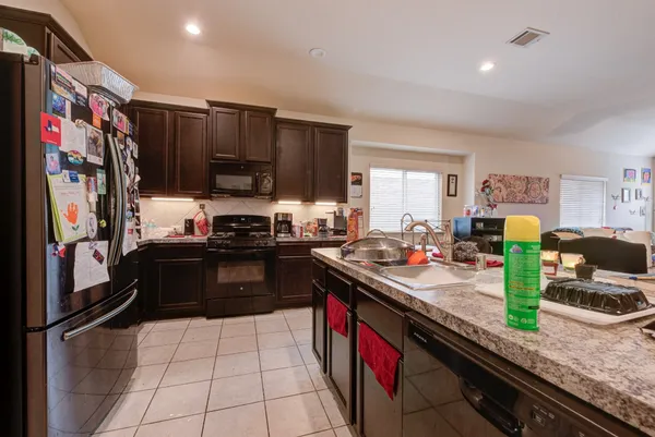 a kitchen with lots of counter top space and appliances