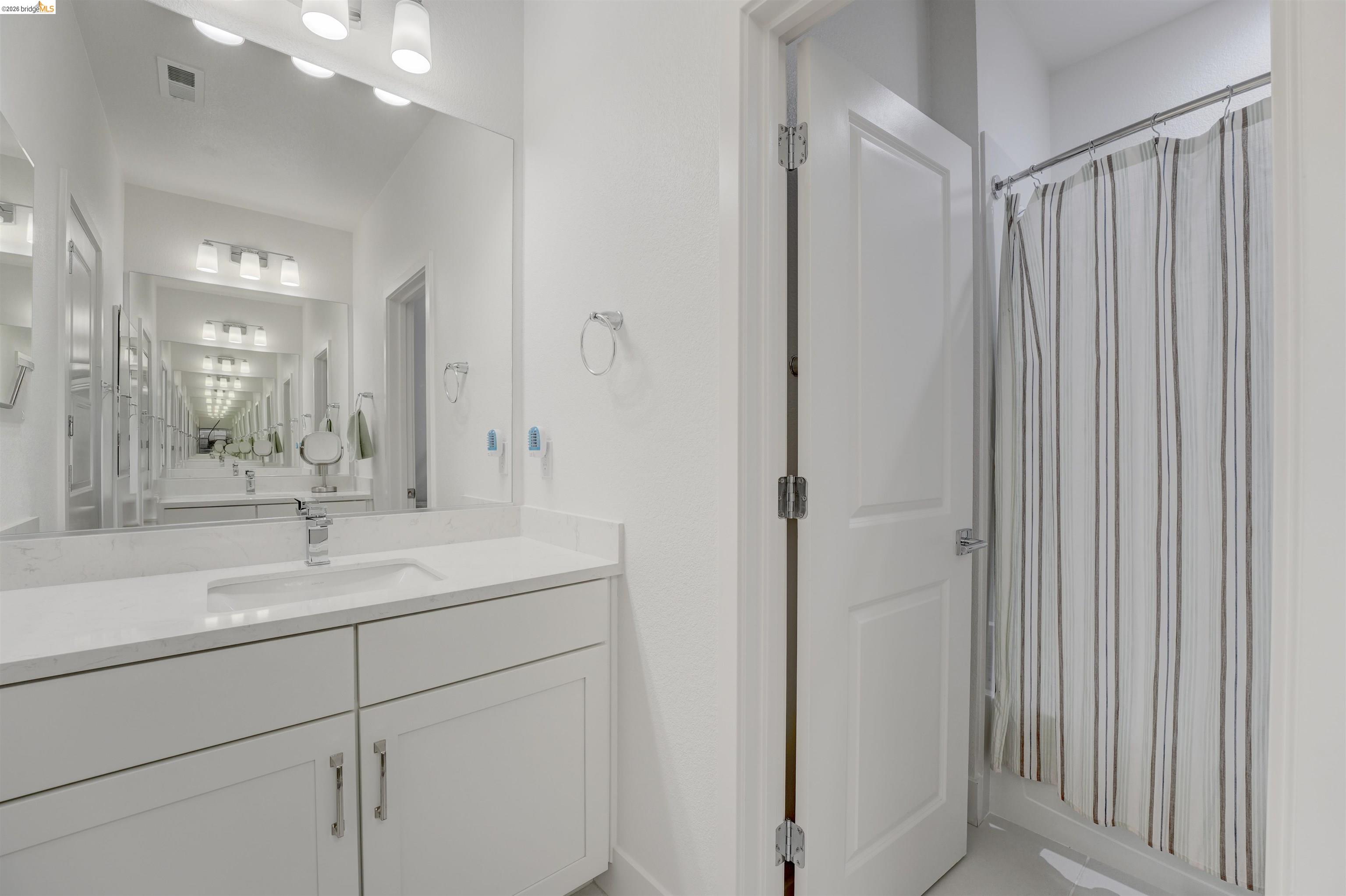 7101 Melon Court San Ramon, CA 94583 - Photo 41 of 58 a bathroom with a sink and mirror