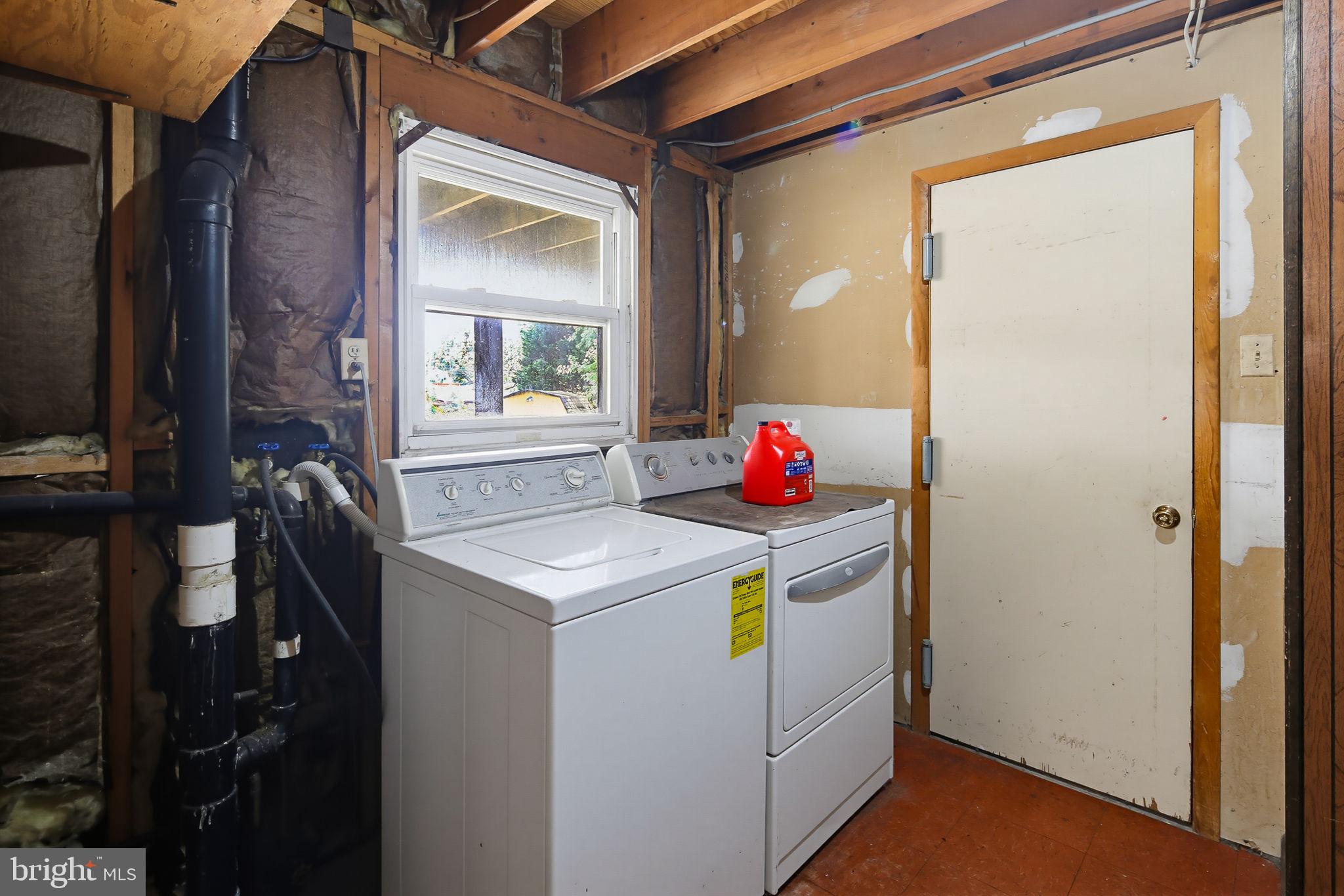 7802 Bastille Road Severn, MD 21144 - Photo 27 of 34 Functional laundry space with natural light.