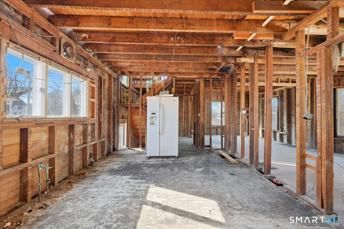 18 Maxson Street Groton, CT 06355 - Photo 12 of 39 a view of an empty room with wooden walls