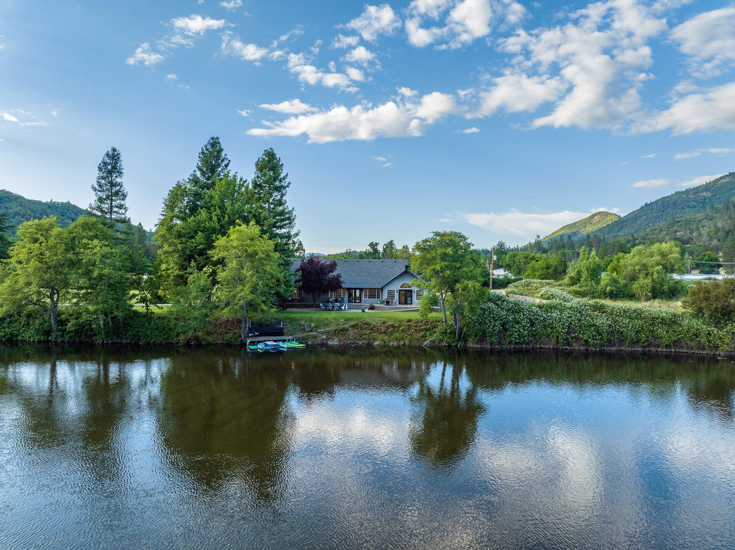 8442 New Hope Road Grants Pass, OR 97527 - Photo 50 of 84 View of the back of the house from over the river