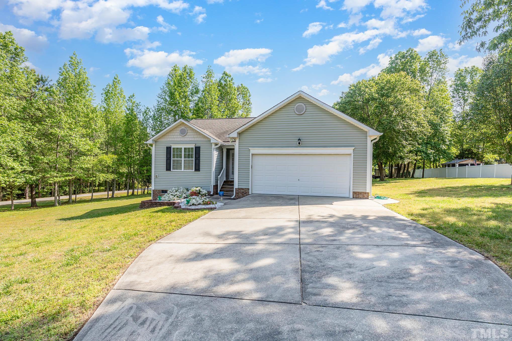 30 Rolling Cloud Drive Louisburg, NC 27549 - Photo 1 of 25 a front view of a house with a yard