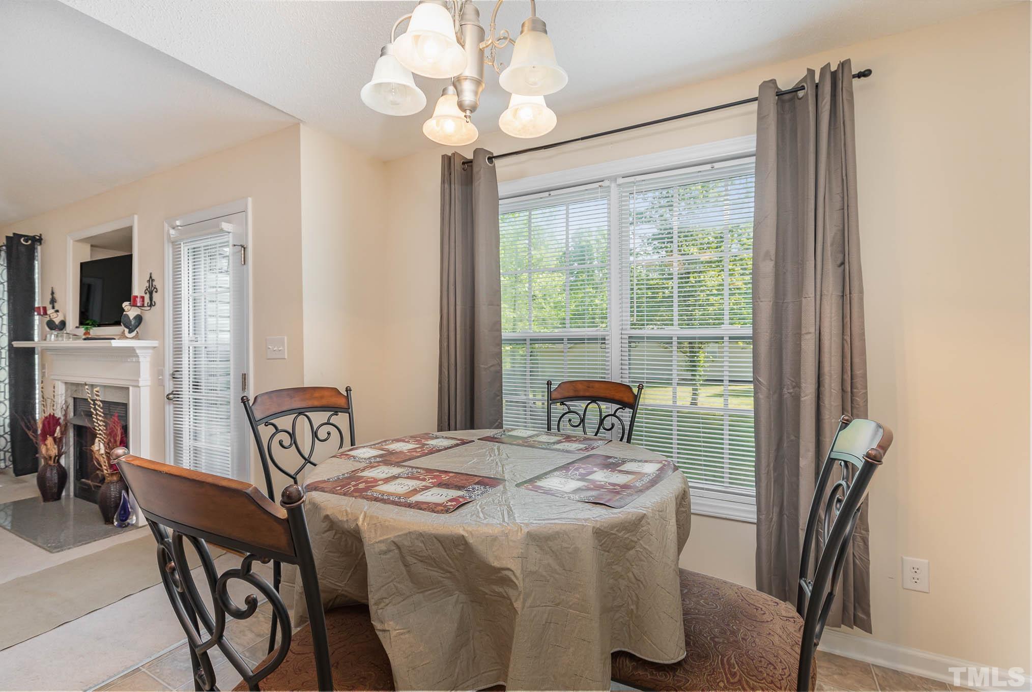 30 Rolling Cloud Drive Louisburg, NC 27549 - Photo 14 of 25 a view of a dining room with furniture window and outside view