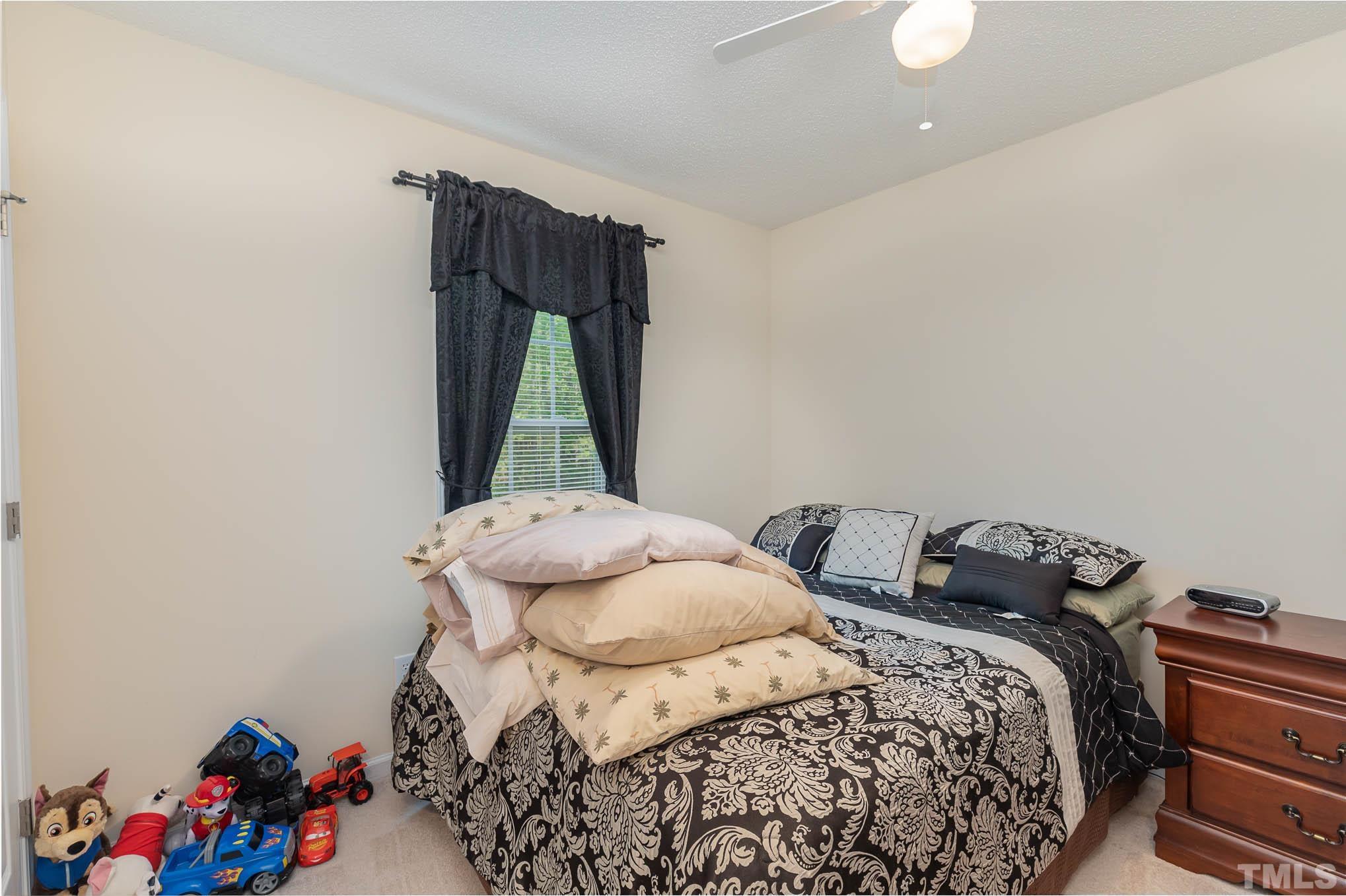 30 Rolling Cloud Drive Louisburg, NC 27549 - Photo 19 of 25 a bedroom with a bed and a window