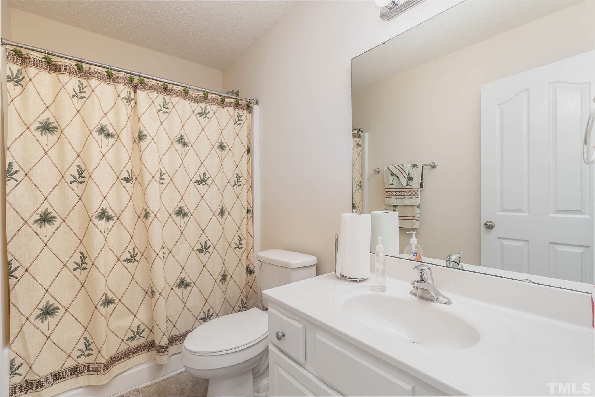 30 Rolling Cloud Drive Louisburg, NC 27549 - Photo 20 of 25 a bathroom with a sink toilet and shower