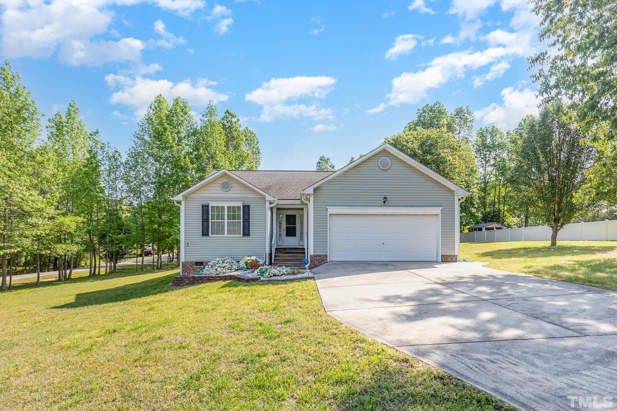 30 Rolling Cloud Drive Louisburg, NC 27549 - Photo 2 of 25 a view of a house with a yard and large tree