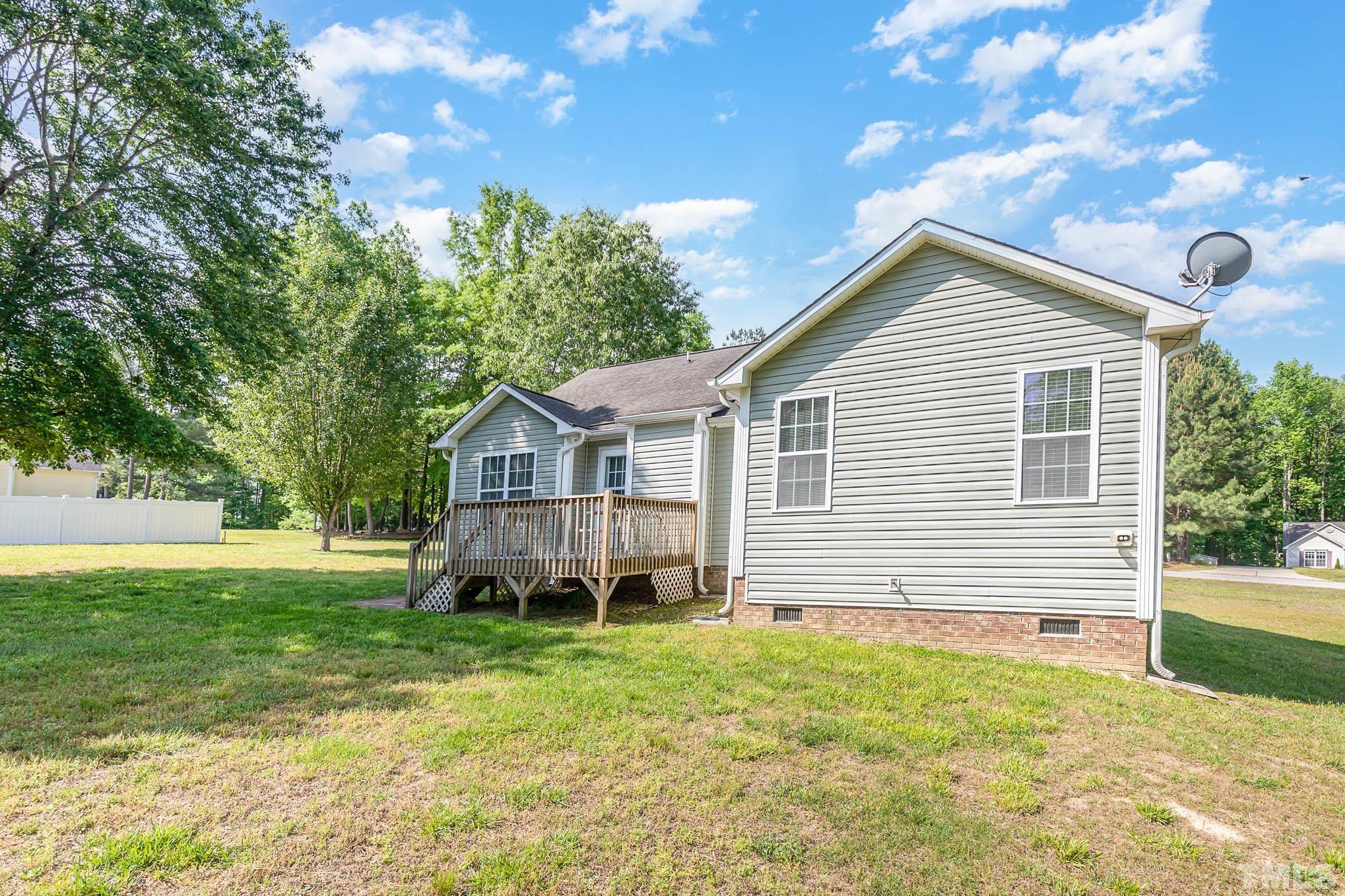 30 Rolling Cloud Drive Louisburg, NC 27549 - Photo 25 of 25 a front view of a house with a garden