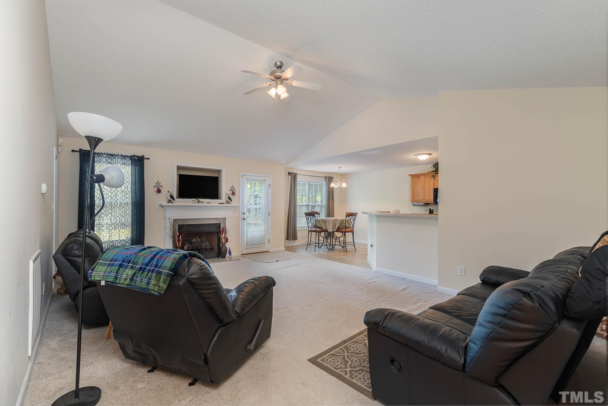 30 Rolling Cloud Drive Louisburg, NC 27549 - Photo 6 of 25 a living room with furniture and a fireplace