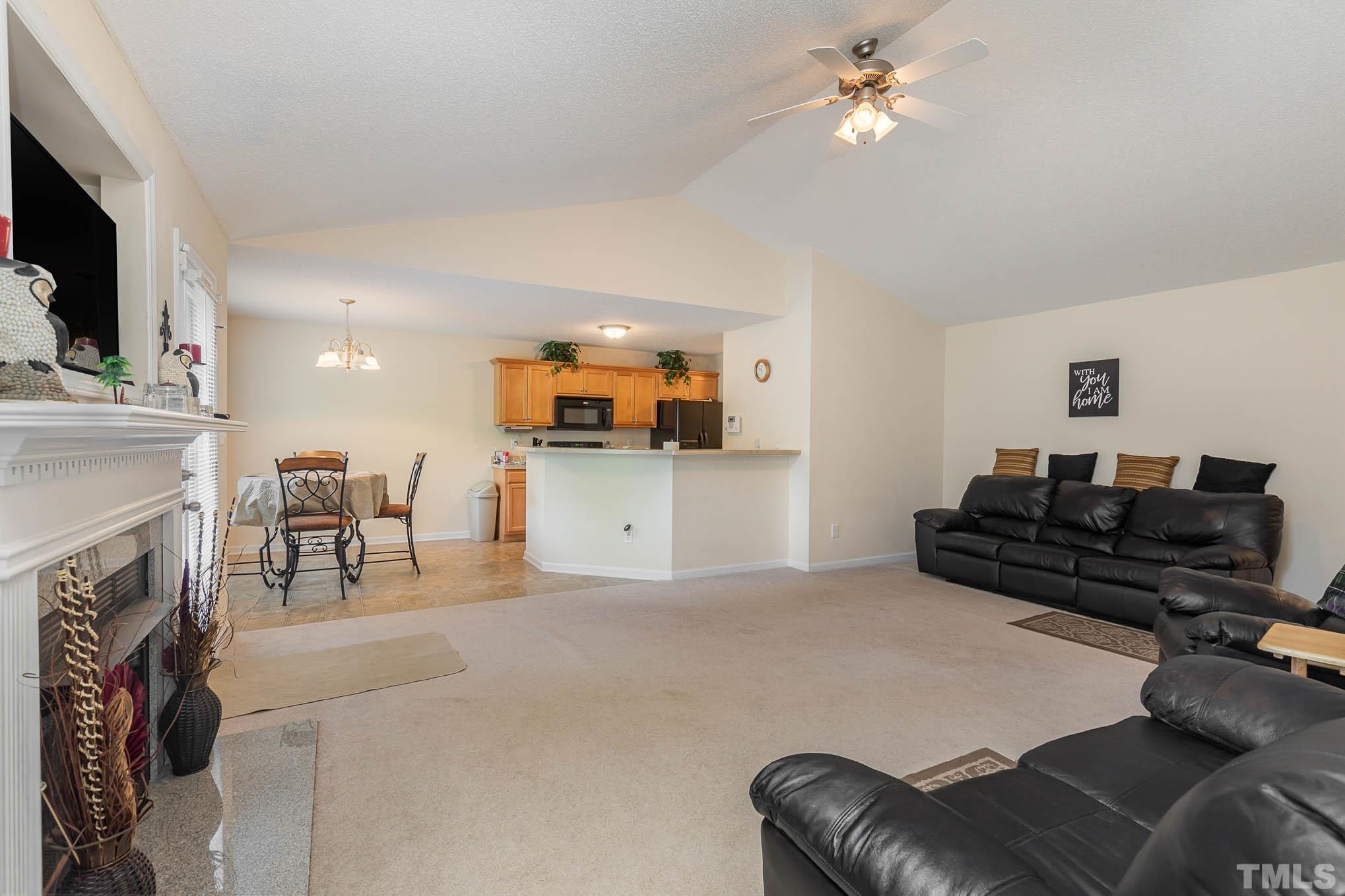 30 Rolling Cloud Drive Louisburg, NC 27549 - Photo 9 of 25 a living room with furniture and a fireplace
