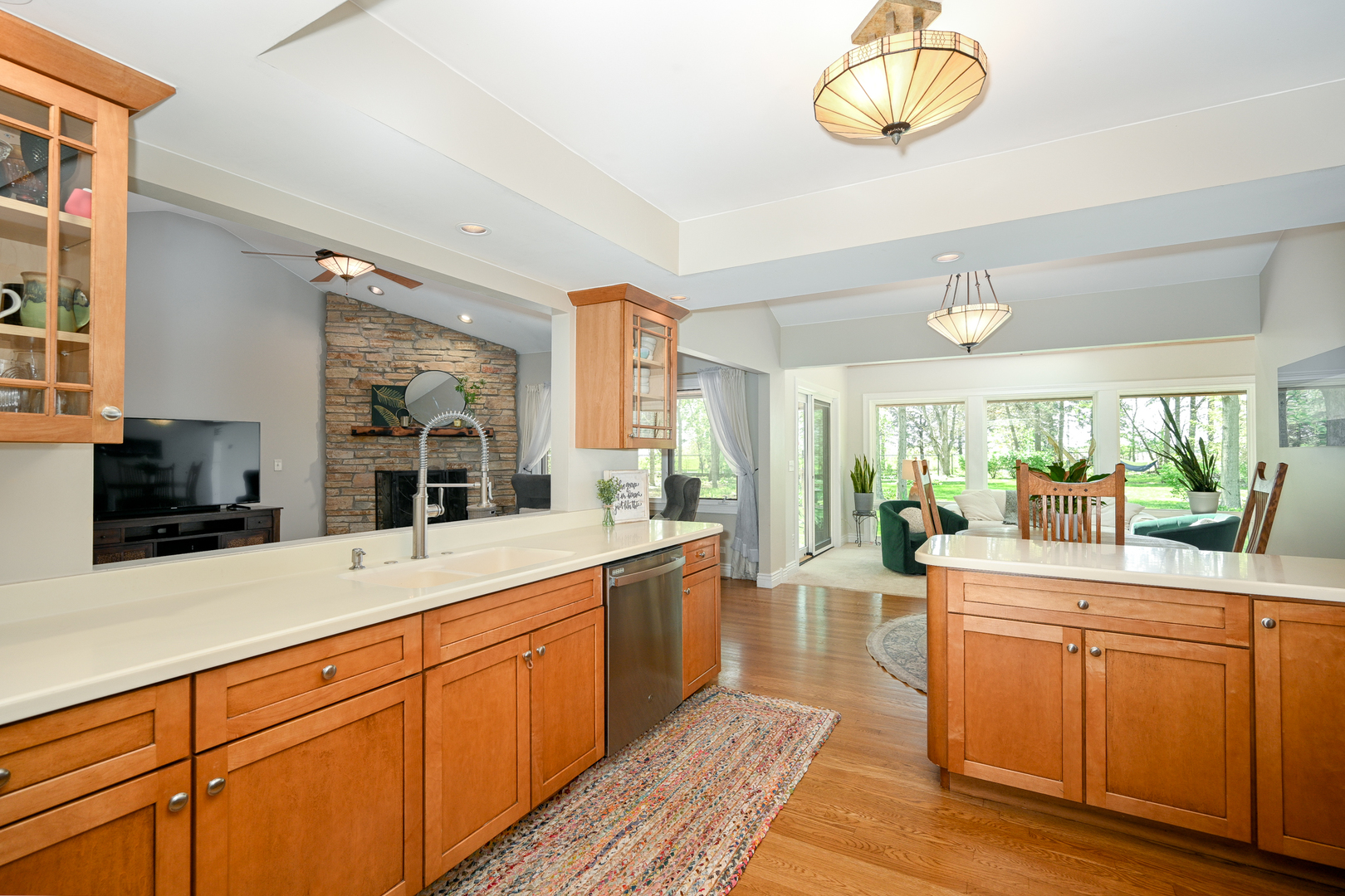 2588 # J Rock Creek Road Plano, IL 60545 - Photo 16 of 39 a large kitchen with kitchen island granite countertop a large window cabinets and stainless steel appliances