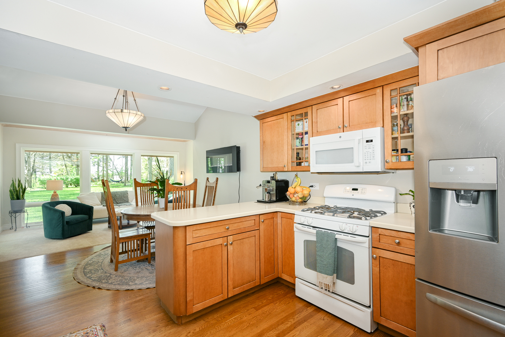 2588 # J Rock Creek Road Plano, IL 60545 - Photo 17 of 39 a kitchen with stainless steel appliances a stove sink and cabinets