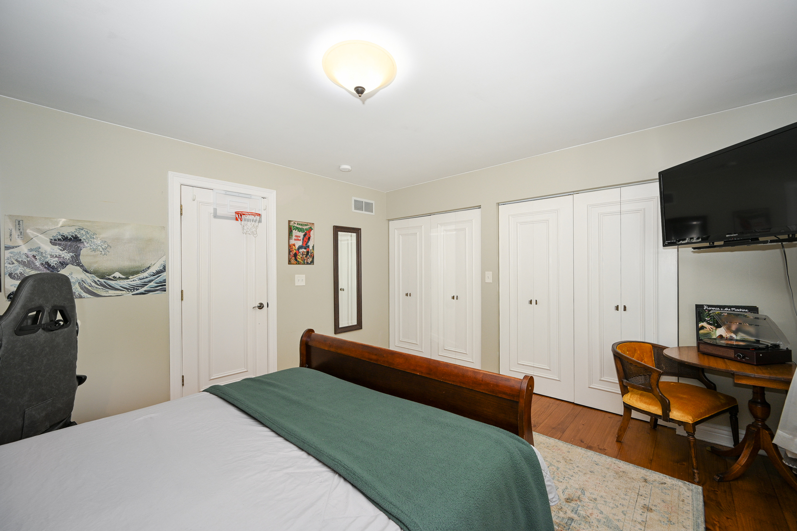 2588 # J Rock Creek Road Plano, IL 60545 - Photo 25 of 39 a bedroom with a bed and a flat screen tv