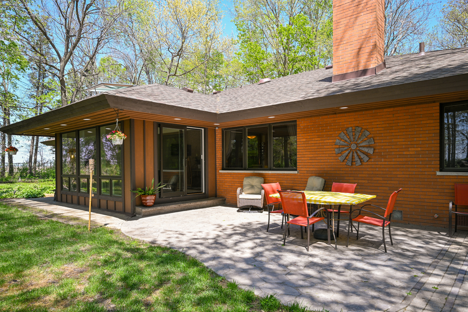 2588 # J Rock Creek Road Plano, IL 60545 - Photo 30 of 39 a view of a patio with a table and chairs under an umbrella