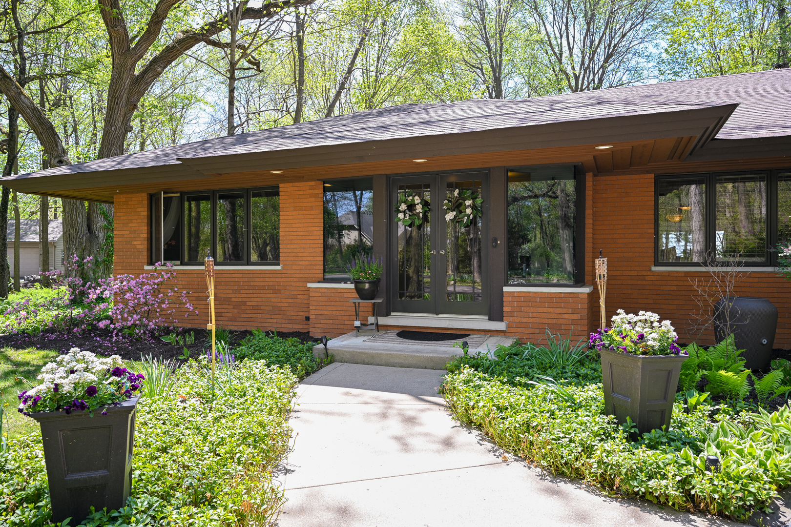 2588 # J Rock Creek Road Plano, IL 60545 - Photo 3 of 39 a front view of a house with a yard garage and outdoor seating