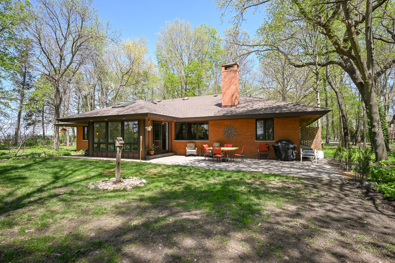 2588 # J Rock Creek Road Plano, IL 60545 - Photo 31 of 39 a view of a house with a yard patio and furniture