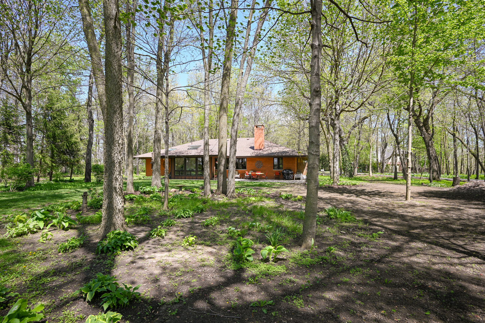 2588 # J Rock Creek Road Plano, IL 60545 - Photo 32 of 39 a front view of a house with a yard and large trees