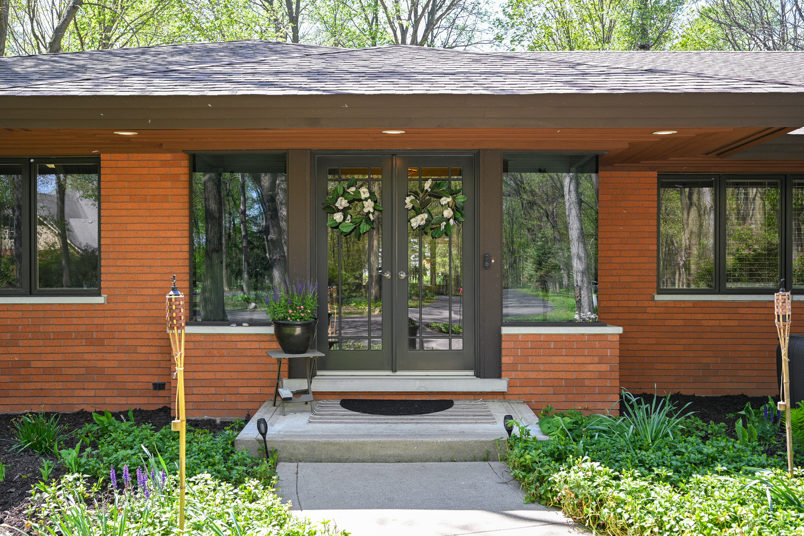 2588 # J Rock Creek Road Plano, IL 60545 - Photo 6 of 39 a porch with a bench and chairs