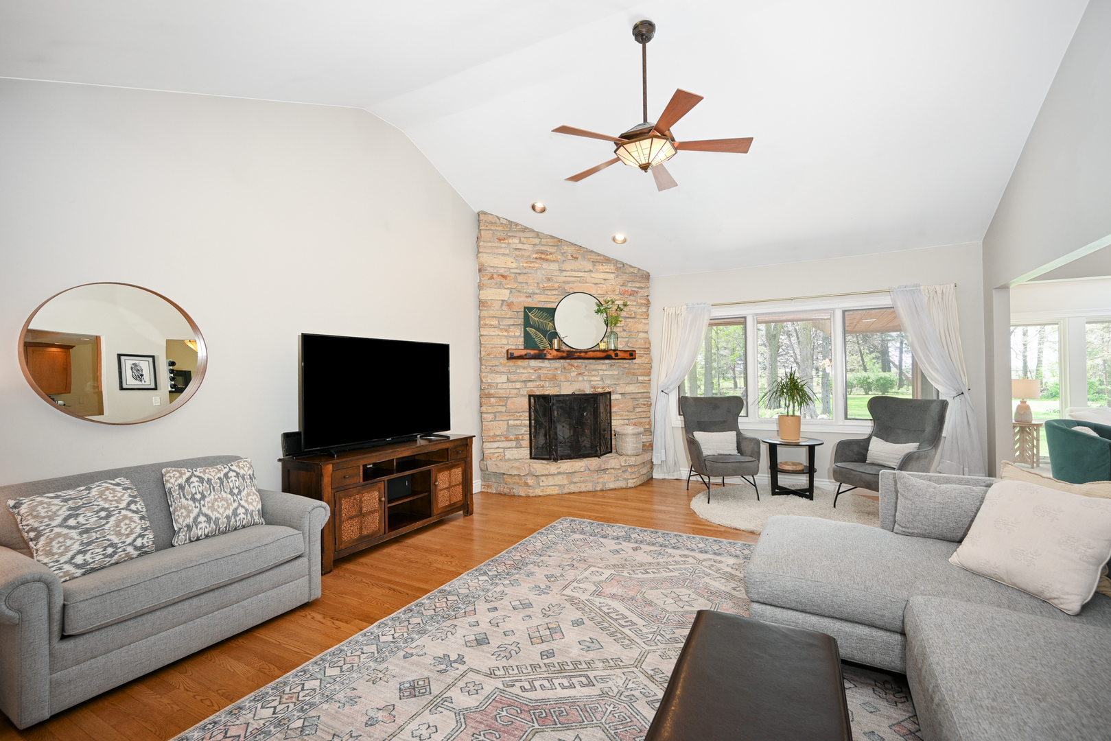 2588 # J Rock Creek Road Plano, IL 60545 - Photo 9 of 39 a living room with furniture flat screen tv and a fireplace