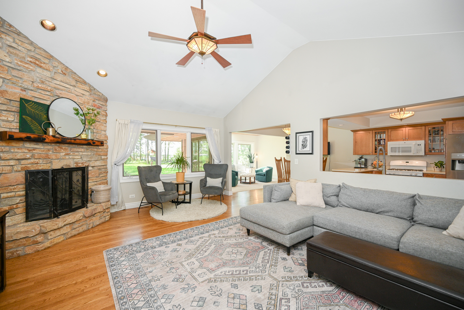 2588 # J Rock Creek Road Plano, IL 60545 - Photo 10 of 39 a living room with furniture fireplace and a large window