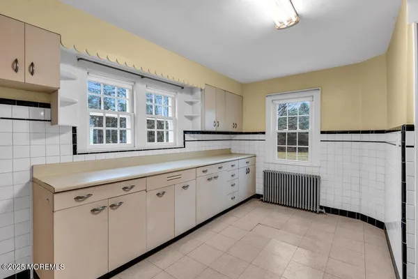 a kitchen with stainless steel appliances granite countertop a refrigerator and a stove