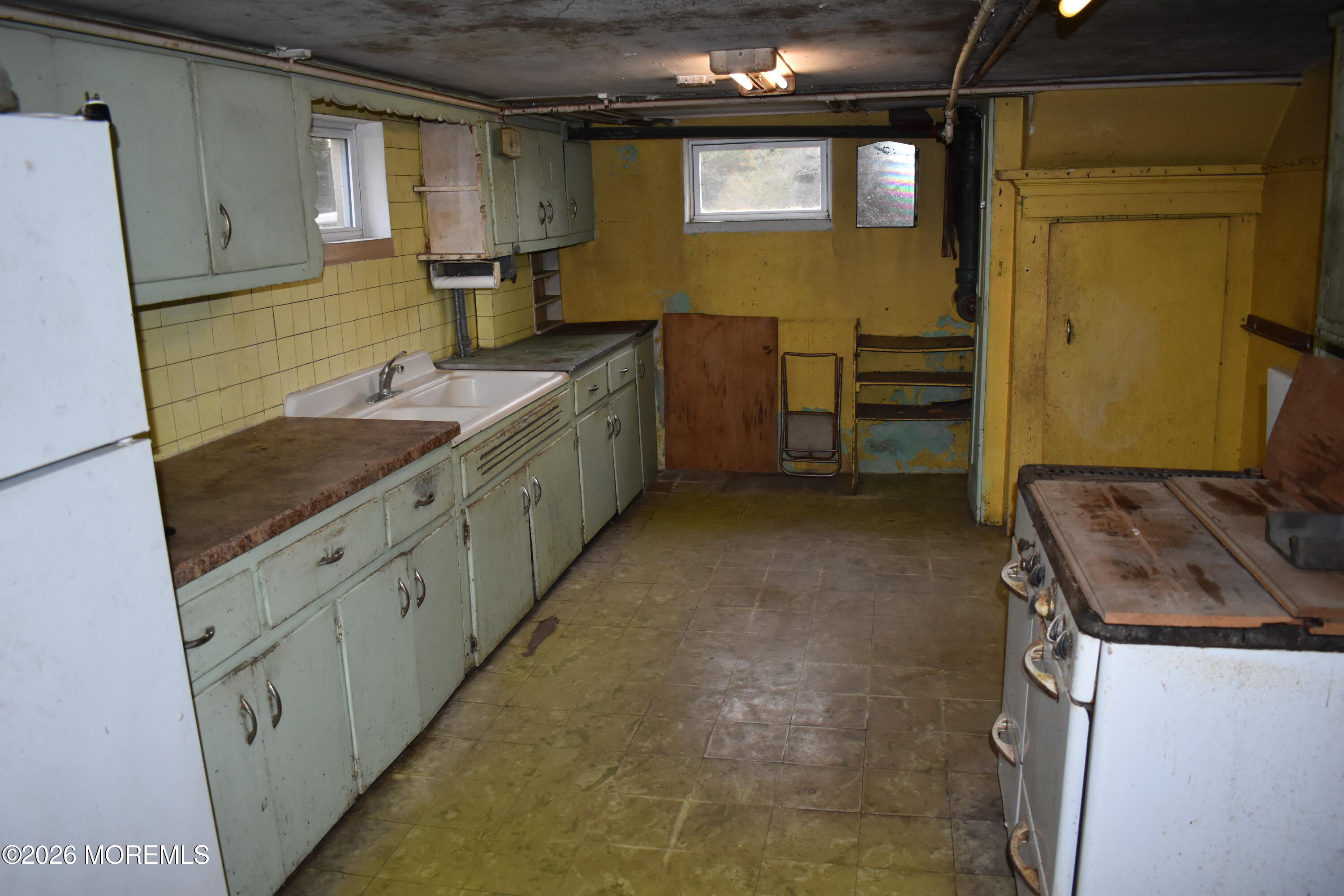 16 Robertsville Road Freehold, NJ 07728 - Photo 25 of 59 a bathroom with a granite countertop sink and a mirror