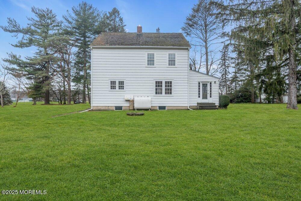 16 Robertsville Road Freehold, NJ 07728 - Photo 27 of 59 a front view of house with yard and green space